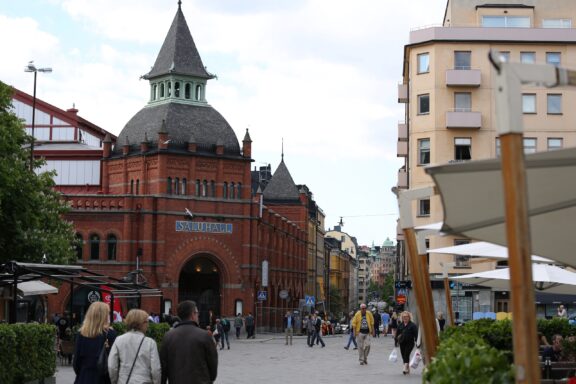 Outdoor View of Stockholm Market Hall with People Östermalms Saluhall, opened in 1888, is often considered one of the best food halls in the world