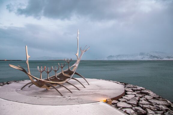 Sun Voyager Sculpture in Reykjavik Against Cloudy Sky The Sun Voyager, Sólfar