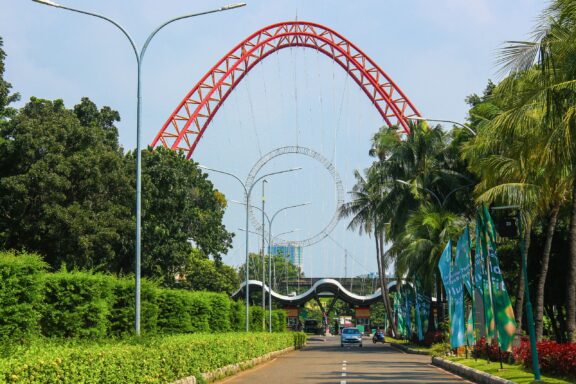 Entrance to Taman Impian Jaya Ancol with Red Arch and Road Entrance to the Taman Impian Jaya Ancol