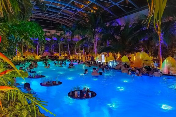 Indoor Tropical Pool at Night Therme Bucharest, one of the largest thermal wellness centers in Europe