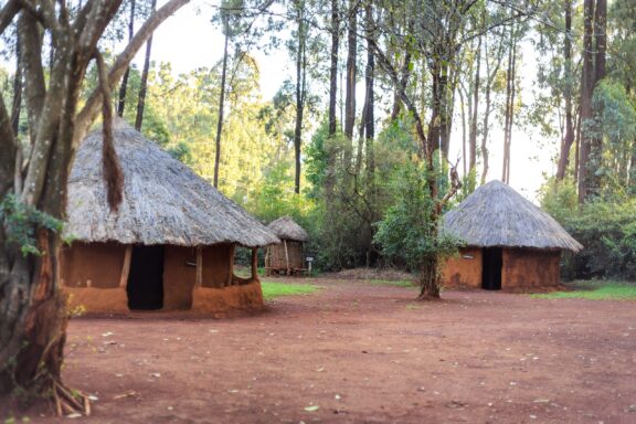 Traditional Thatched Huts in a Clearing Traditional tribal hut of Kenyan people in the Bomas village near Nairobi