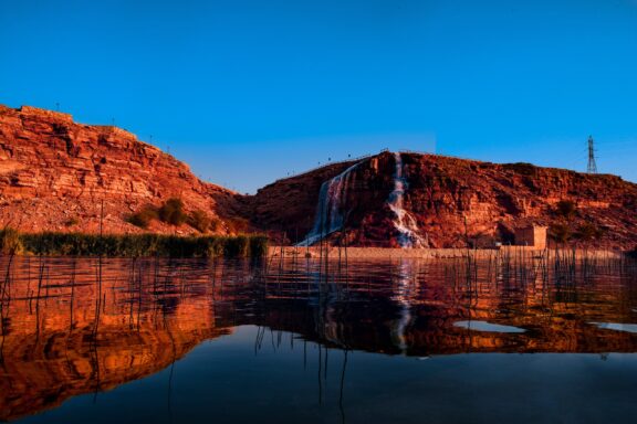 Wadi Nemar Waterfall Reflection at Dusk Wadi Nemar, known for its lake, dam, and the impressive waterfall that cascades from the dam