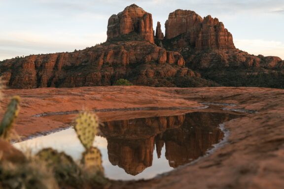 Red rocks reflect in a pool of water in Sedona, Arizona.