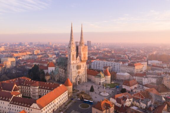 An aerial view of the Zagreb Cathedral and surrounding city at dusk in Zagreb, Croatia.