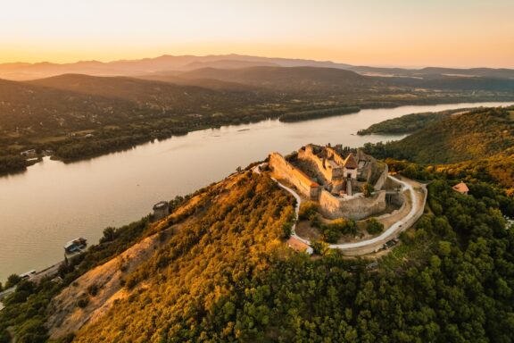 Visegrád looks over the Danube from a hill at sunset in Hungary.