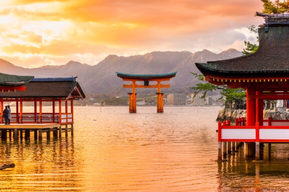 The famous floating torii gate, Miyajima, stands in the water in Japan.