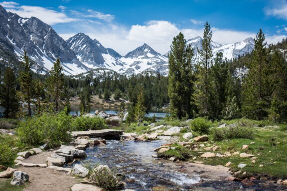 A small creek backed by mountains flows through Little Lakes Valley.