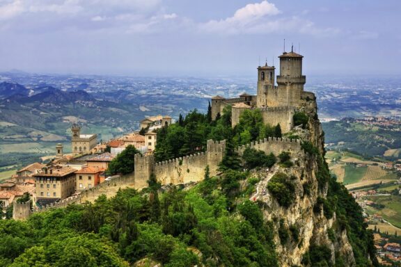 Guaita Tower looks over San Marino from a rocky cliff.