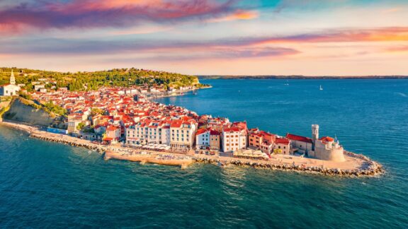 An aerial view of Piran, Slovenia extending out into the Adriatic Sea.