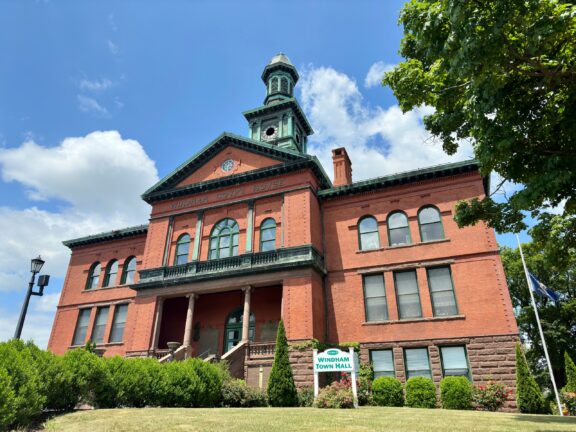 A low-angle view of the Windham Town Hall building in Windham County.