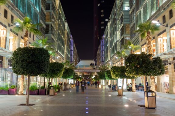 Night View of a Tree-Lined Boulevard in Amman Amman Boulevard, surrounded by modern buildings