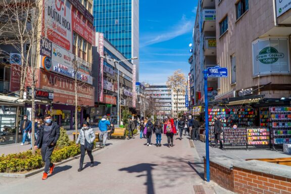Downtown Street Scene with Pedestrians and Shops Pedestrians stroll through the downtown area of Ankara