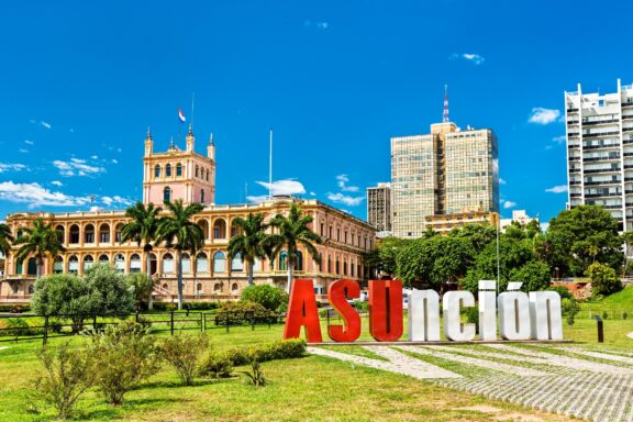 Asunción Cityscape with Landmark Building and Large Lettering "Asunción" Monument
