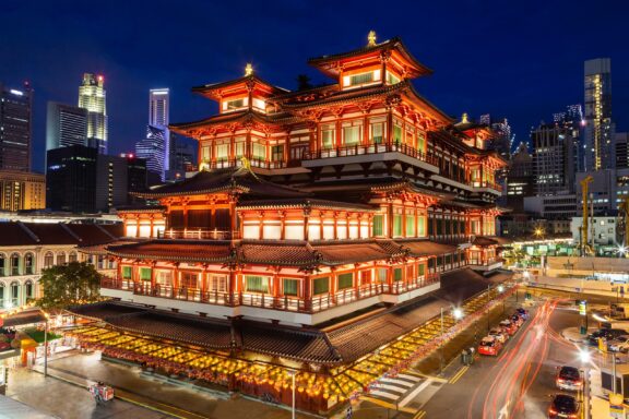 Illuminated Traditional Temple at Night in Urban Setting Buddha Tooth Relic Temple in Chinatown