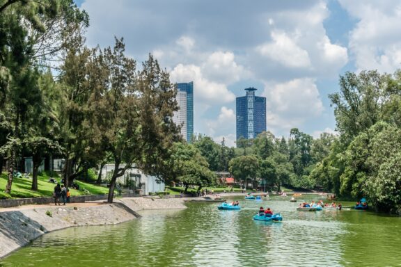 Boating in Chapultepec Park with City Skyline Chapultepec Park, one of the largest and most significant urban parks in the world