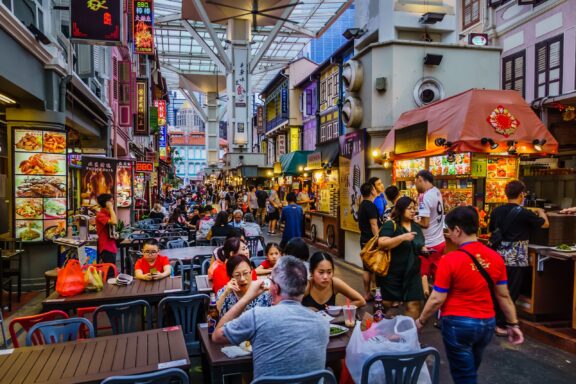 Crowded streets filled with food vendors in Chinatown, Singapore