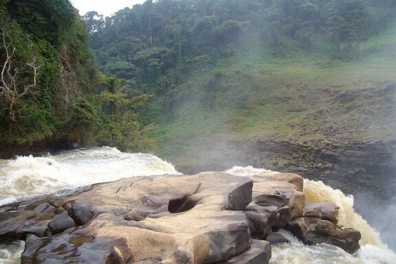 Misty Waterfall and Rocky Riverbank The Chutes de Loufoulakari, or Loufoulakari Falls