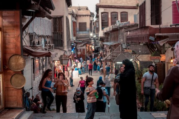 Bustling Street Scene with Locals in Damascus The lively streets of Damascus, an ever-changing tableau of local life