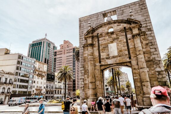 Tourists Visiting Historic Citadel Gateway in Urban Setting Gateway of the Citadel, one of the last remnants of the colonial wall that once encircled Montevideo