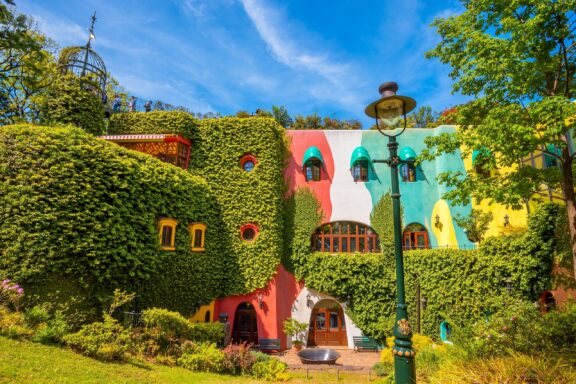 Colorful Ghibli Museum Exterior with Lush Greenery The Ghibli Museum, designed by Hayao Miyazaki