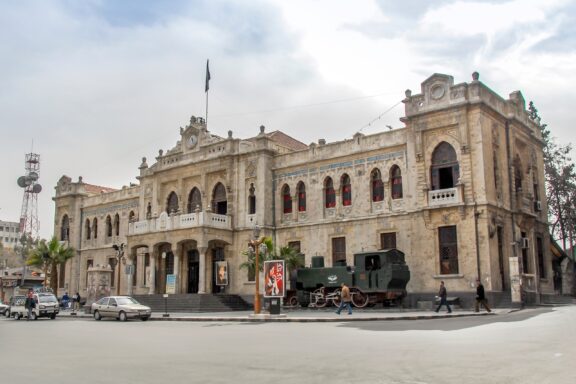 Historic Hejaz Railway Station Building with Vintage Train Hejaz Railway Station, built during the Ottoman era, was a key point connecting Damascus to Mecca