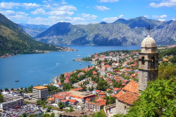 A view of Kotor and its bay on a sunny day in Montenegro.