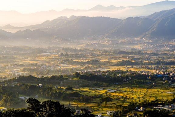 Sunny Agricultural Fields with Distant Mountains Agriculture field in Kathmandu