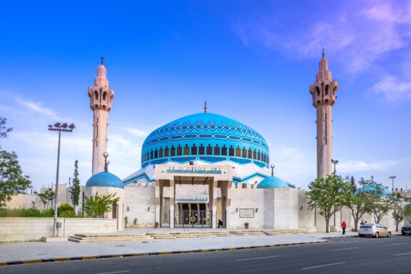 King Abdullah Mosque under blue sky King Abdullah Mosque, built in the late 20th century, is known for its striking blue dome