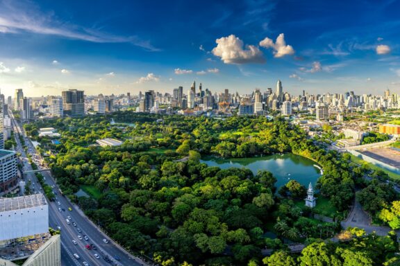 Aerial View of Bangkok Cityscape with Green Park Scenic sunset and landscape over Bangkok