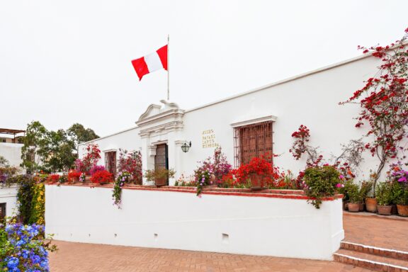 Facade of Larco Museum with Peruvian Flag Larco Museum, which houses an impressive collection of pre-Columbian artifacts