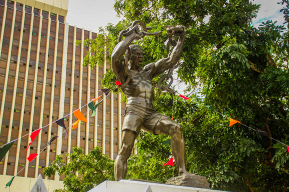 Statue of Man Breaking Chains in Lusaka The Freedom Statue in Lusaka, commemorating the country's struggle for independence from British colonial rule