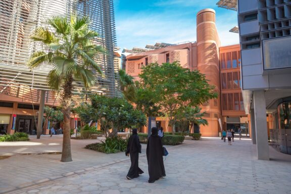 Pedestrians Walking in Masdar City Streets inside the Masdar City