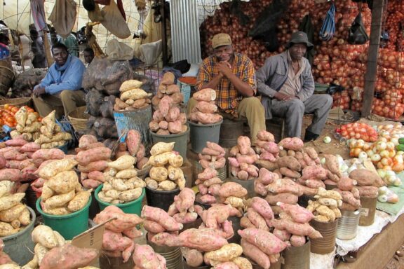 Vendors Selling Produce at a Market Stall Mbare Musika, a reflection of the city's history, culture, and vibrancy