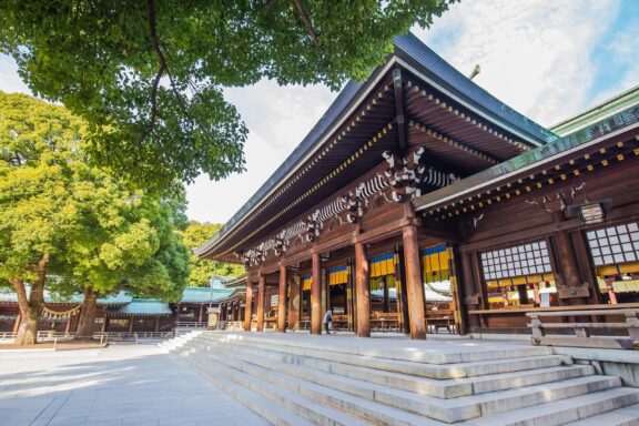 Meiji Shrine Entrance Under Blue Sky Meiji Jingu, or Meiji Shrine, dedicated to the deified spirits of Emperor Meiji