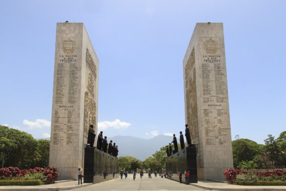 Twin Stone Monuments with Inscriptions Under Blue Sky Caracas venezuela may 17 2015: tourist are seen around the monumento