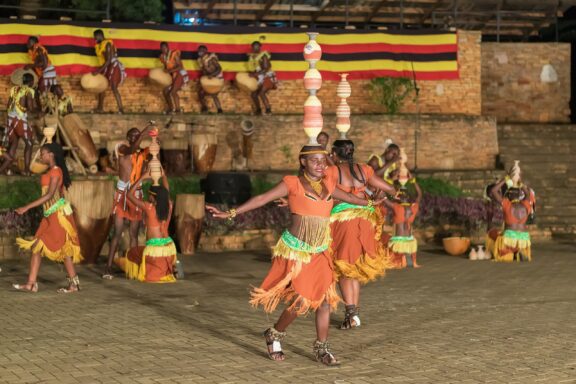 Dancers performing at the Ndere Cultural Centre, dressed in traditional Ugandan wear