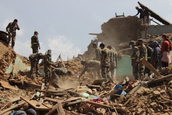 Rescue Workers Amidst Earthquake Rubble Nepal army clearing the rubbles after the earthquake damage in