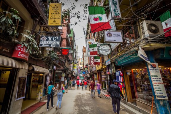 Bustling Street Scene with Pedestrians and Shops Kathmandu's bustling narrow streets, reflecting the rich cultural heritage