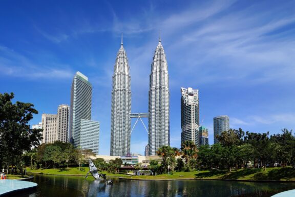 Petronas Twin Towers Against Blue Sky Petronas Twin Towers, a symbol of Malaysia's advancement