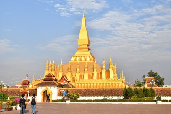 Golden Stupa under Blue Sky Pha That Luang: Dating back to the 3rd century
