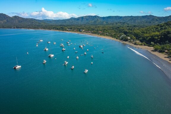 An aerial view of Potrero Beach and boats sitting in the water just off shore in Guanacaste, one of Costa Rica’s provinces. 