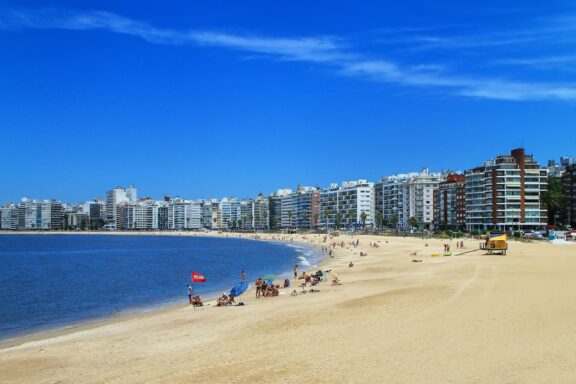 Sunny Day at Pocitos Beach with City Skyline Pocitos Beach, a sought-after spot for locals and tourists