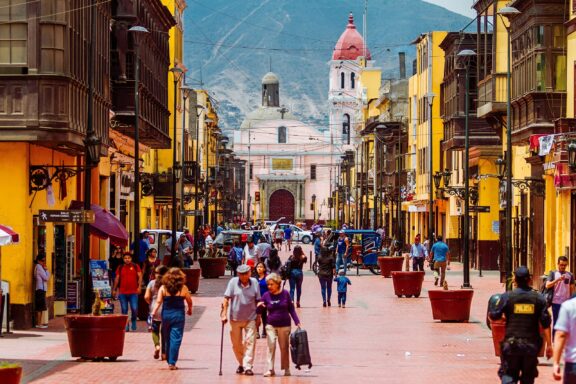 Pedestrian Street in Lima with Mountain View Rimac, a lively street, interweaving daily life, commerce, and history in the heart of the city