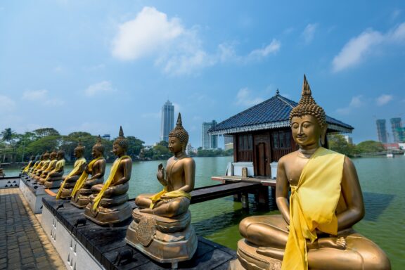 Buddha Statues Overlooking Water at Seema Malaka Temple Buddha statues in Seema Malaka Temple