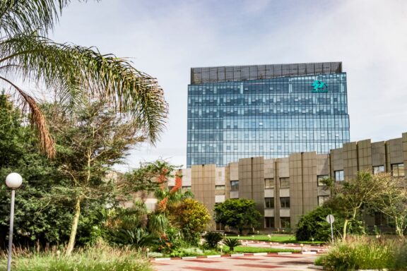 Modern Office Building Amidst Greenery The Sun Share Tower, a contemporary office structure