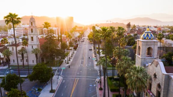 A view of a street in historic downtown Riverside, California at sunset.