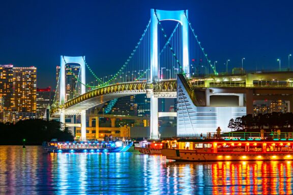 Tokyo Rainbow Bridge Illuminated at Night The Rainbow Bridge is an iconic suspension bridge constructed from 1987 to 1993