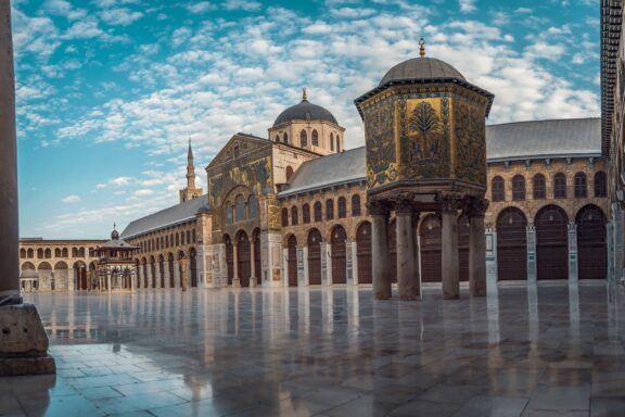 Courtyard of the Umayyad Mosque with Minaret Panoramic day photo of the great mosque of the umayyads