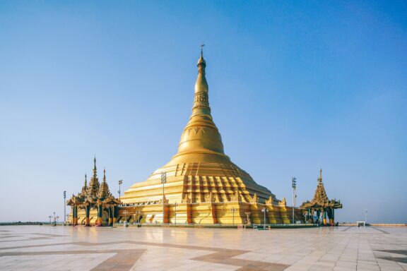Golden Pagoda Against Blue Sky Uppatasanti Pagoda, reflecting Myanmar's rich cultural and spiritual essence