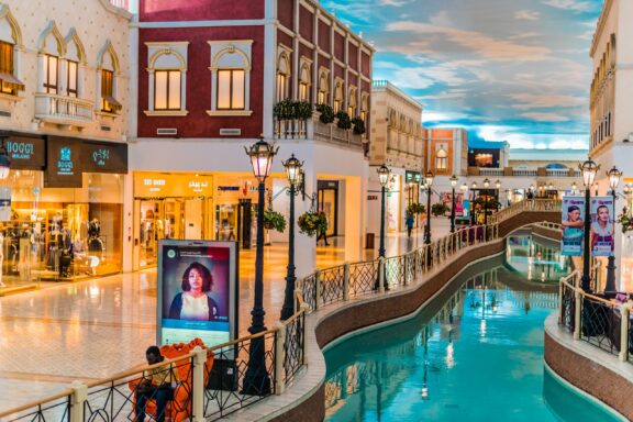 Villaggio Mall, designed like an Italian village, offers an exquisite shopping experience amidst canals and gondolas